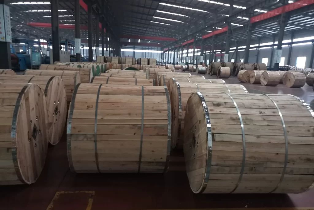 Packaged cable drums stored in the factory warehouse