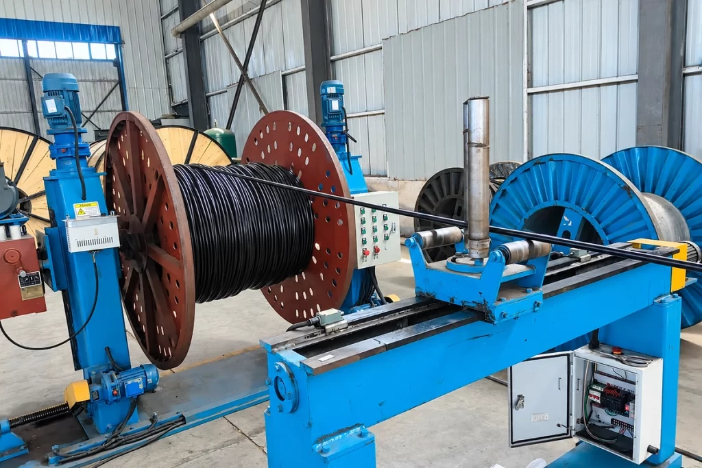 cable production line with finished cable being wound onto a reel